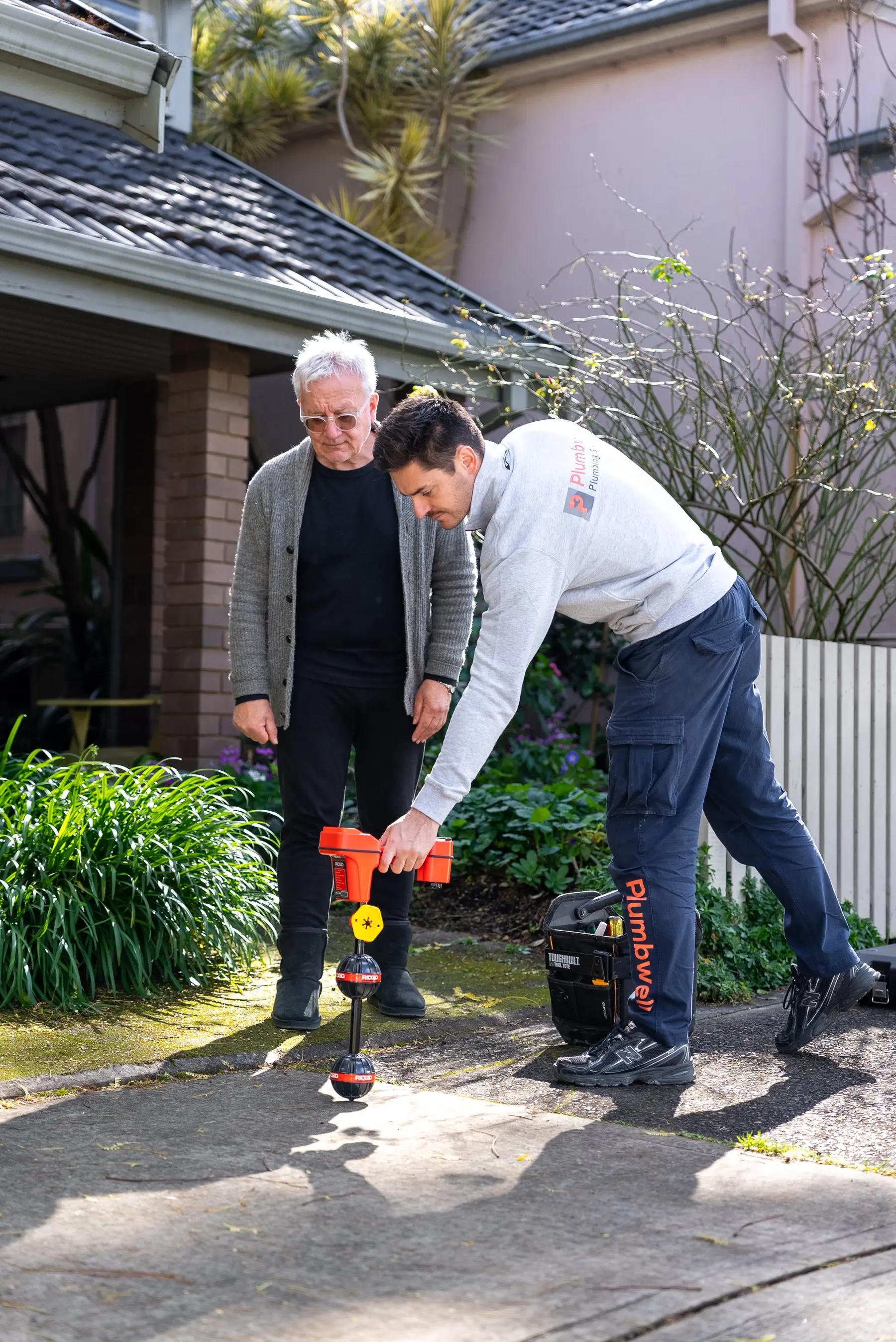 A Plumbwell plumber clearing a blocked drain in Camperdown